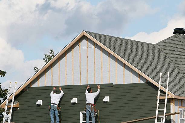 Professional Emergency Siding Repair technician working in Kittredge, CO